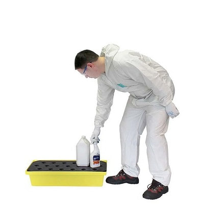 a man keeps the bottle in a small spill tray with grid